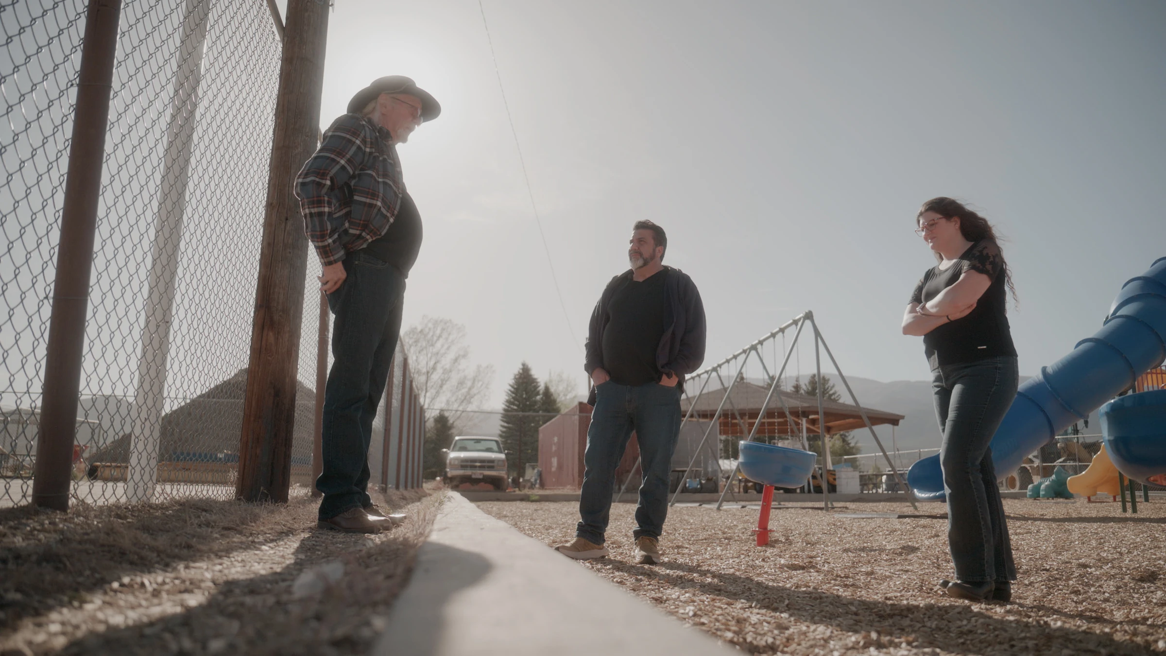 A conversation beside a playground in Circleville, Utah